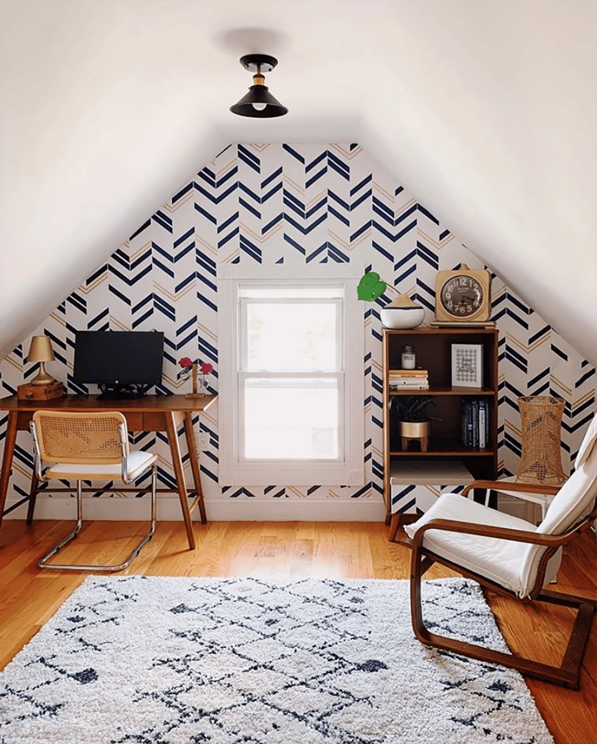 blue and white wallpaper as decor for a wall that is slanted