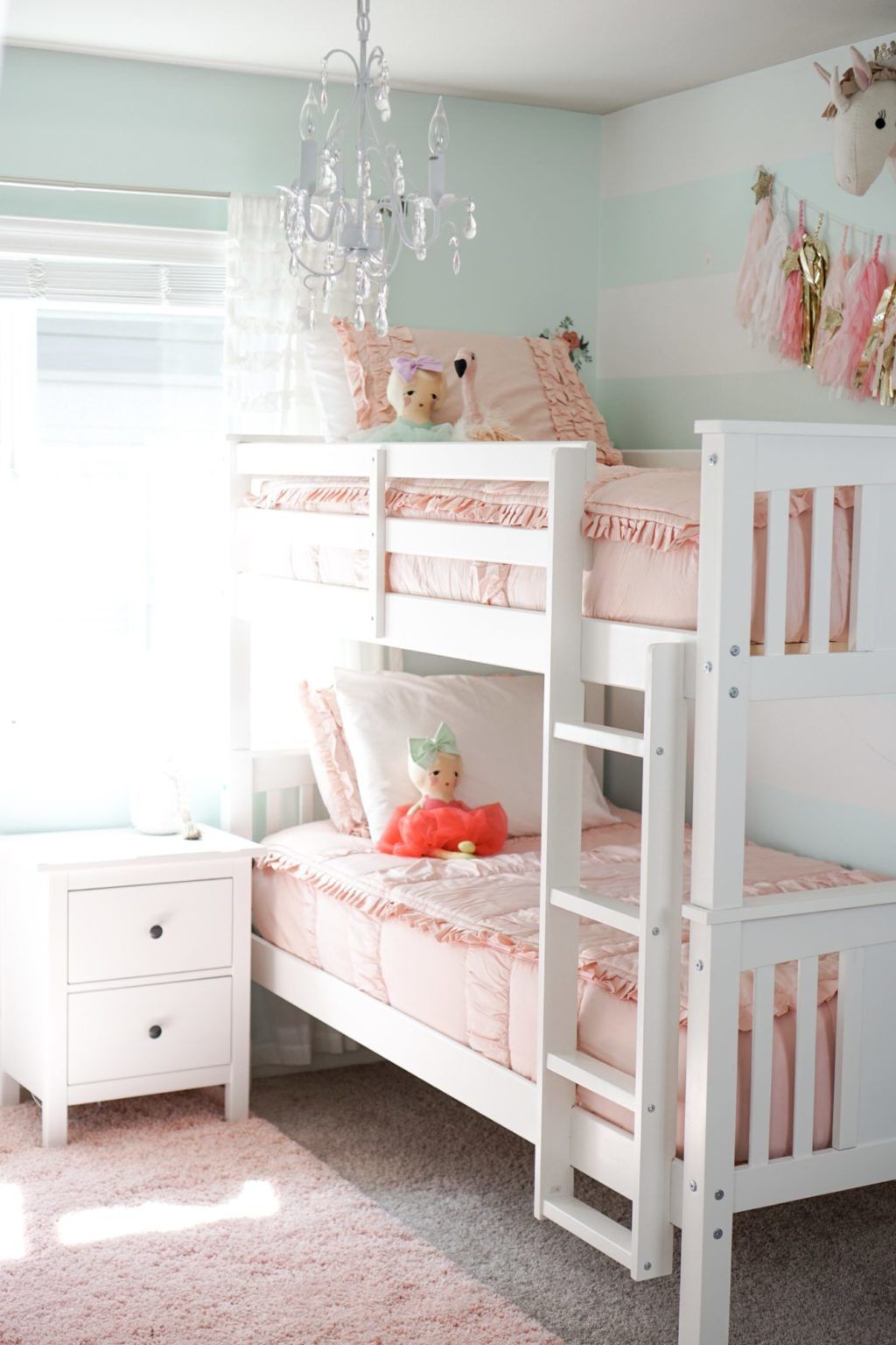 white and pink bedroom design with with aesthetic bunk beds
