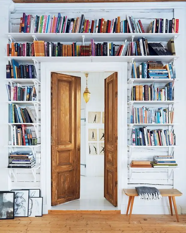 colorful books over door shelf