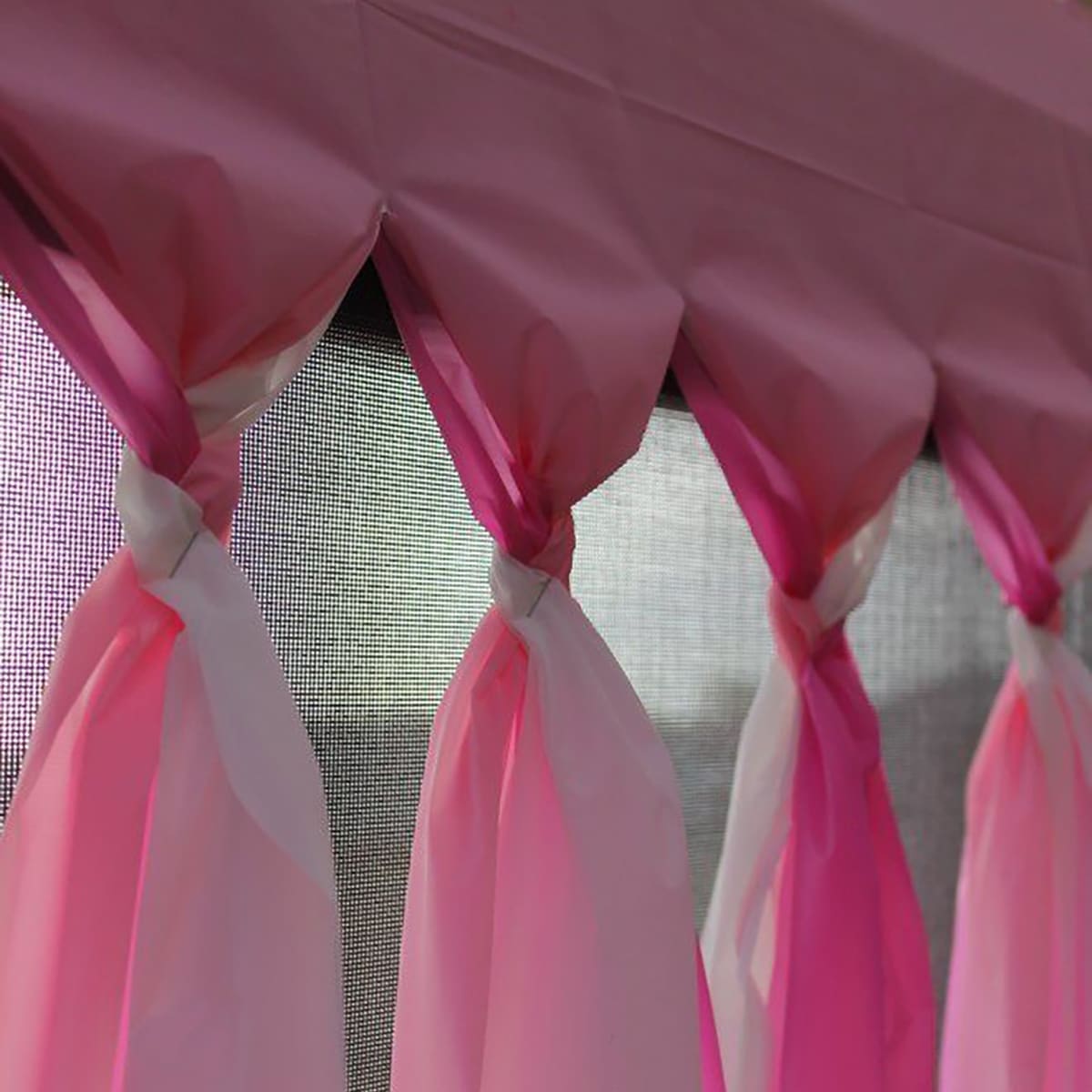 DIY Braided Plastic Tablecloth Party Backdrop