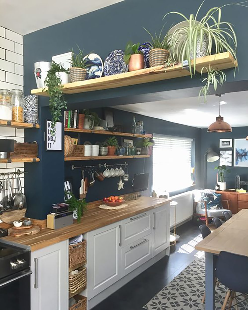 kitchen above door shelf decor with plants and kitchenware