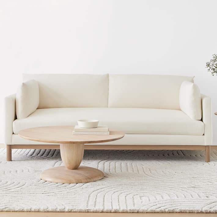 Add a Bold Rug framing your Beige Sofa.