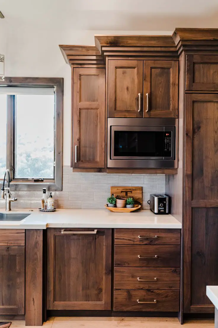 Add some metal accents in your kitchen for contrast and create a more cheerful space.