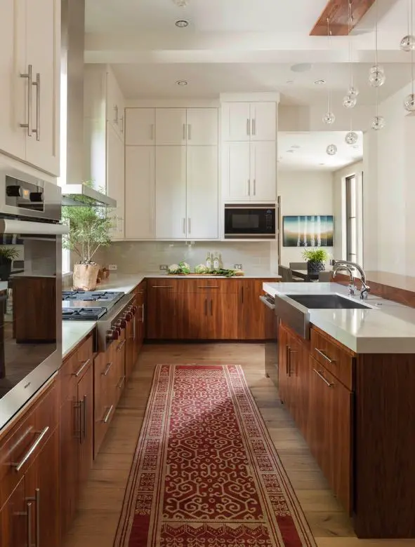 Bring in some plants to inject some life into your cherry wood cabinets.