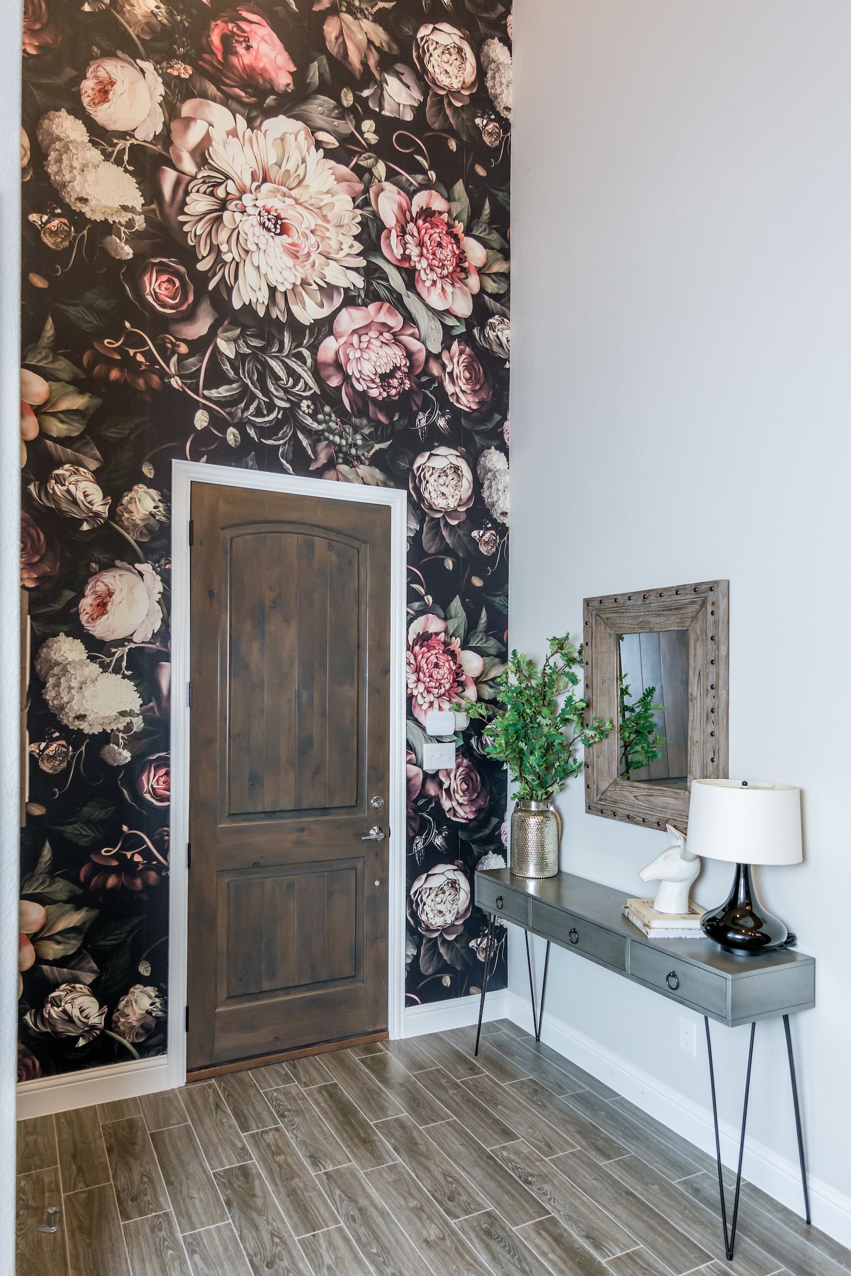 Use wallpaper, paint, or decorative molding to add extra interest to a two-story wall.