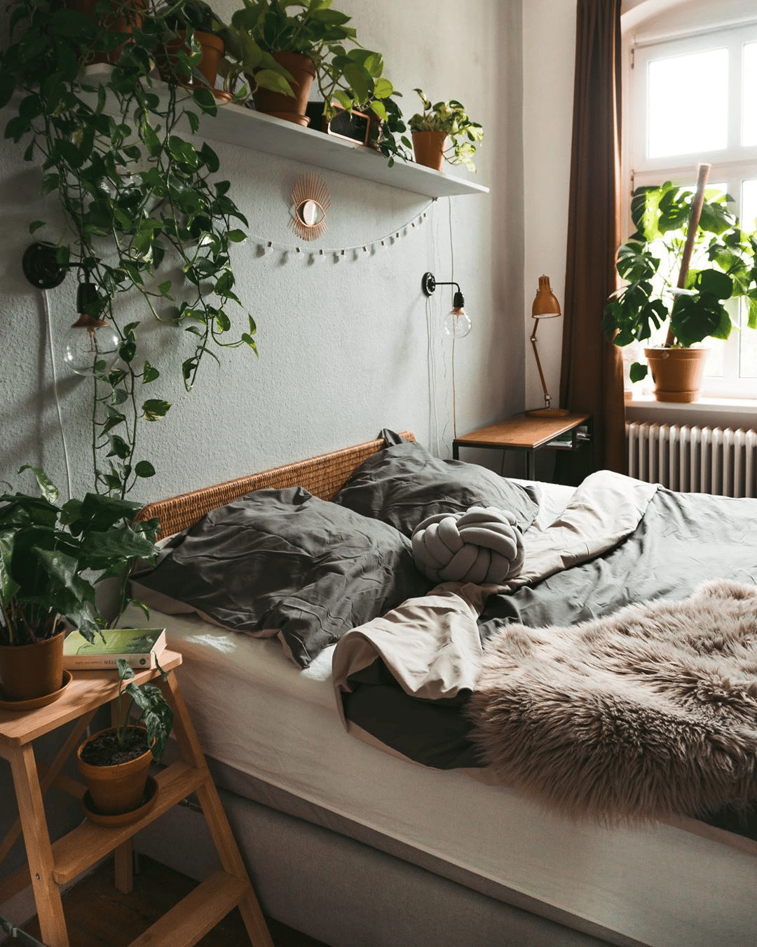 Add houseplants or flowers to the long rectangular bedroom to add life and color.