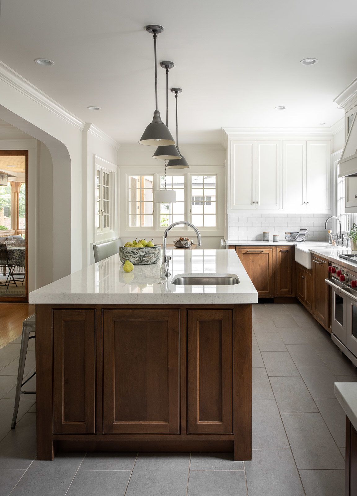 Remove any dark tile or countertops and replace them with lighter options.