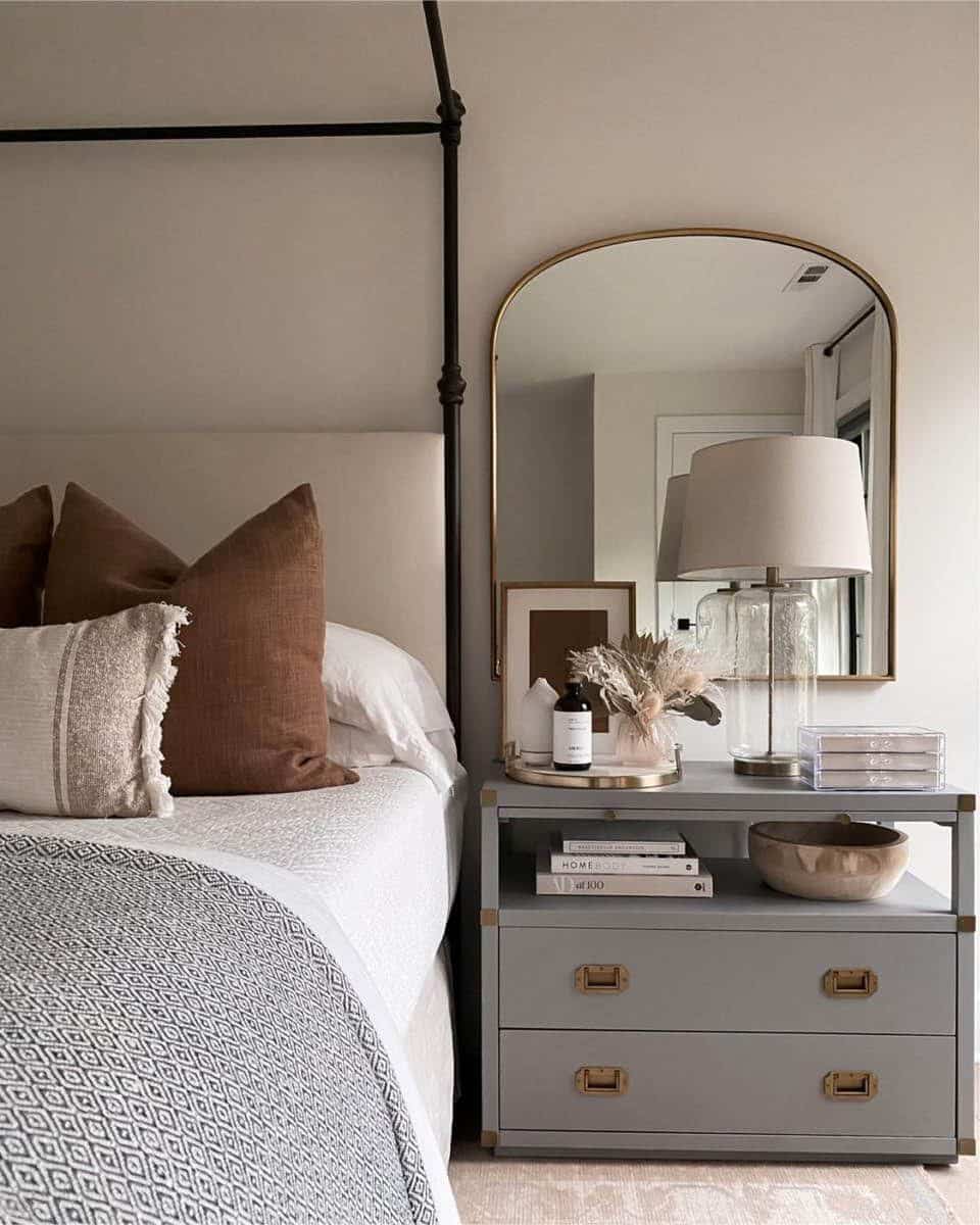 Show a serene scene- a bedroom with only one nightstand can appear more serene and calming.