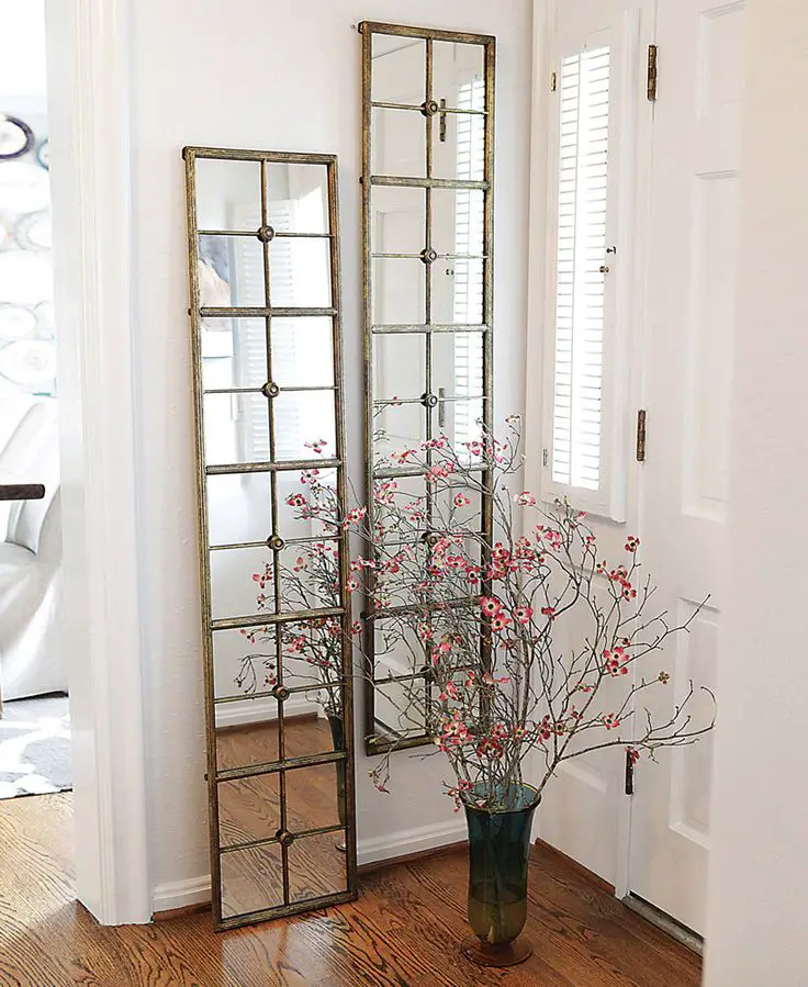 Think about incorporating mirrors and reflective surfaces to add depth and dimension to the wall.