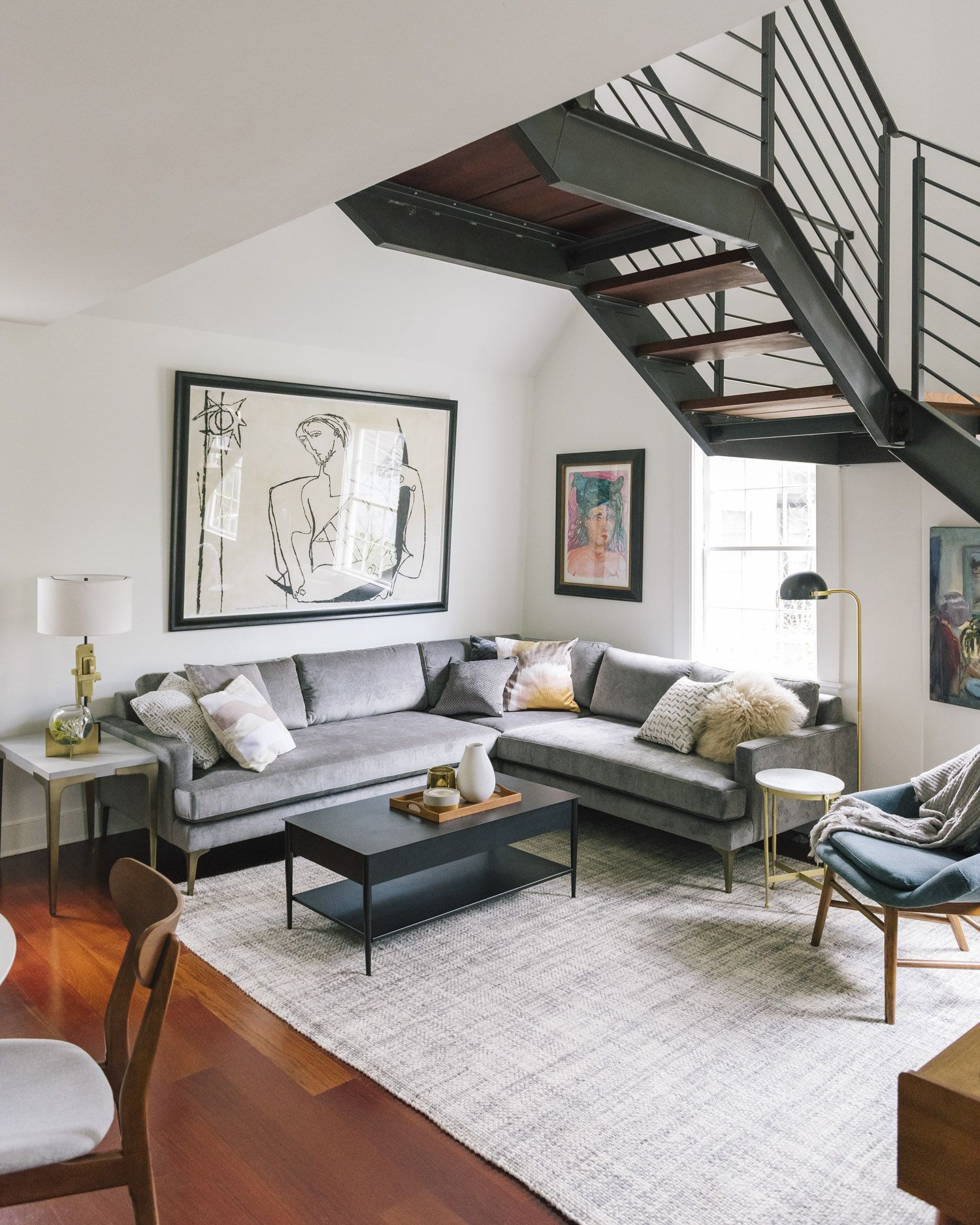 Rugs on orange hardwood floors should soften the surface and add visual interest.