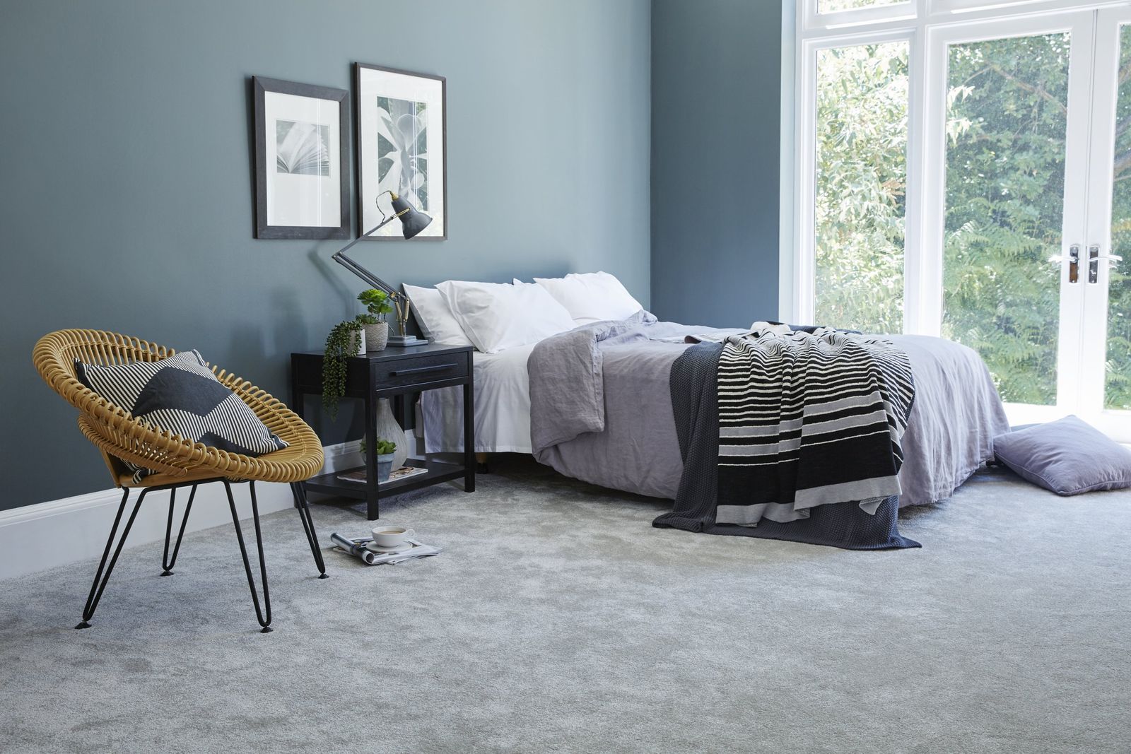 In case you want to tone down the bold blue carpet, add other colors like brown, beige, or black.