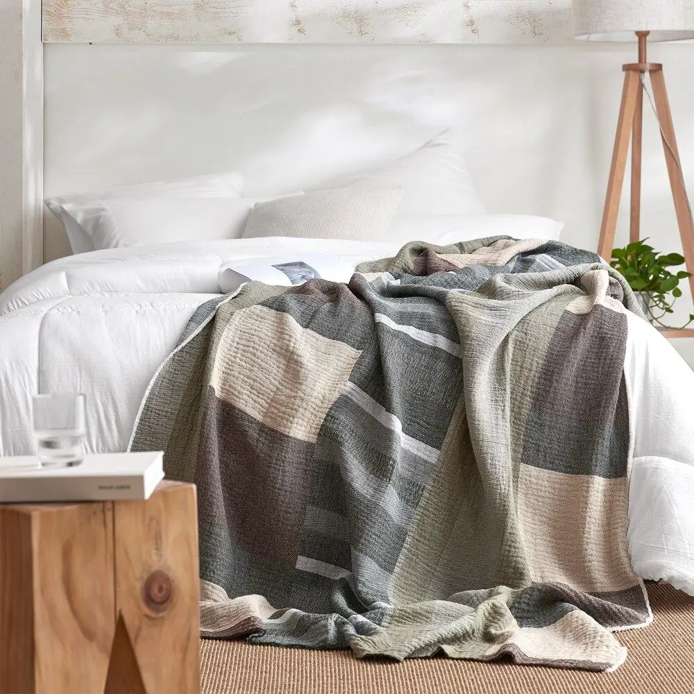 When decorating beds, wrap them around a bedpost for an interesting look and extra warmth.