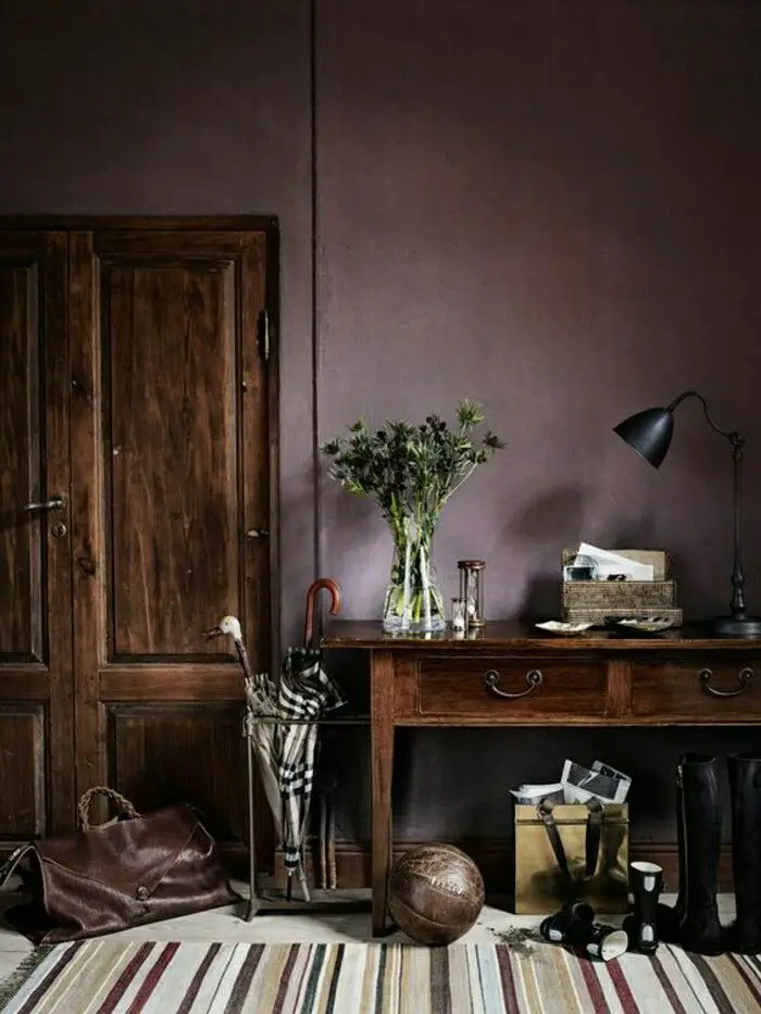 Purple paint color adds elegance and sophistication to any bedroom set-up with dark brown furniture.