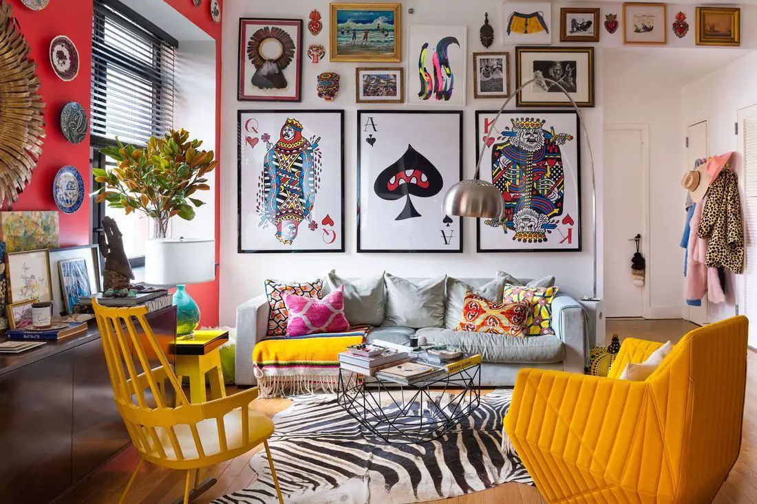 Create a creative formal living space with eclectic furniture, bold colors, patterned rugs, and eye-catching accents to…