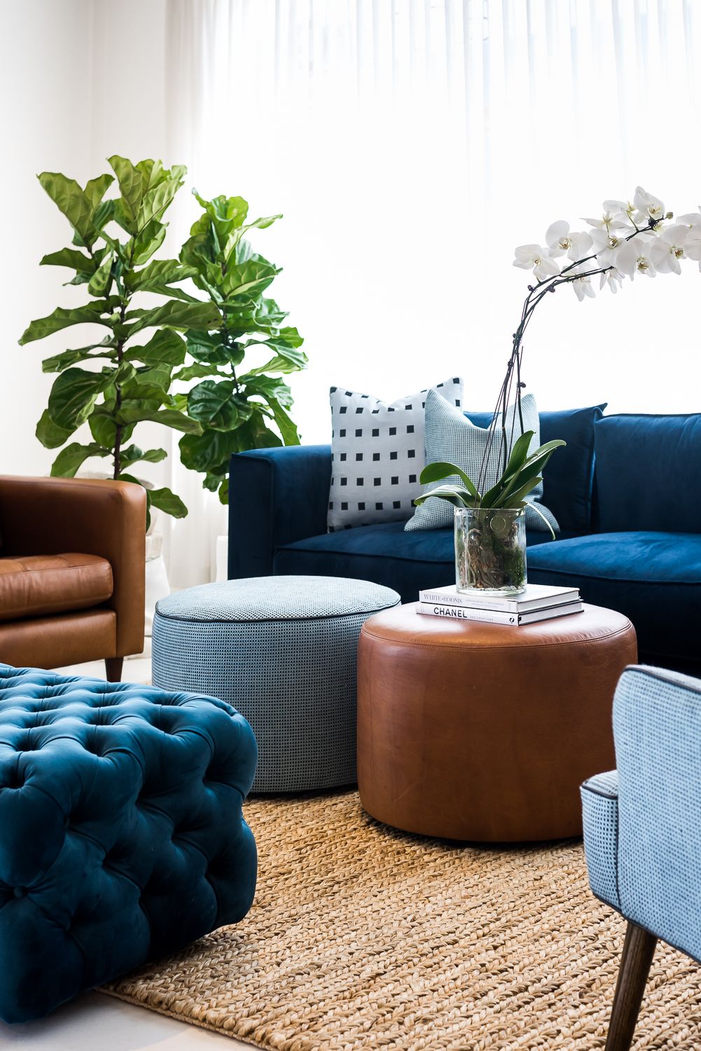 Navy Blue and Tan – Create an inviting living room with navy blue walls contrasting against tan beige tiles.