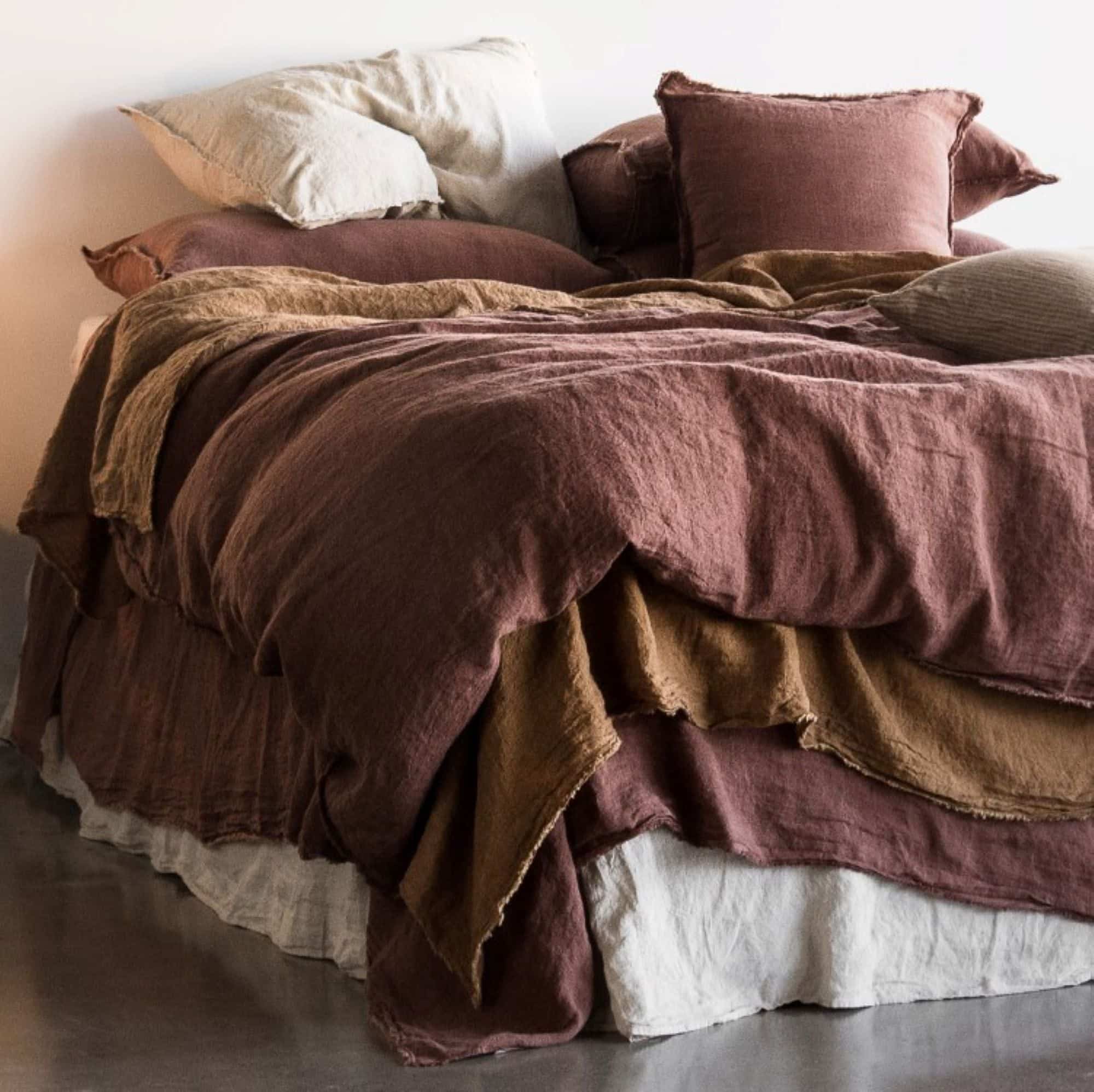 Layer up for a more textured bedroom look and use multiple throws in varying colors and textures.