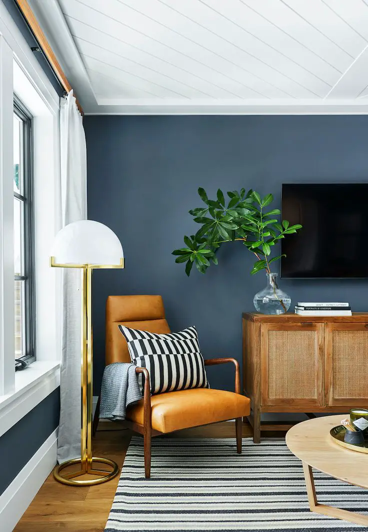 Yellow brings brightness and happiness to any room with dark bedroom furniture, perfect for waking up in the morning.
