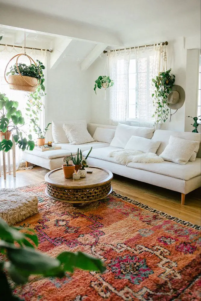 Break up the room with two large contrasting rugs on either side of the room.