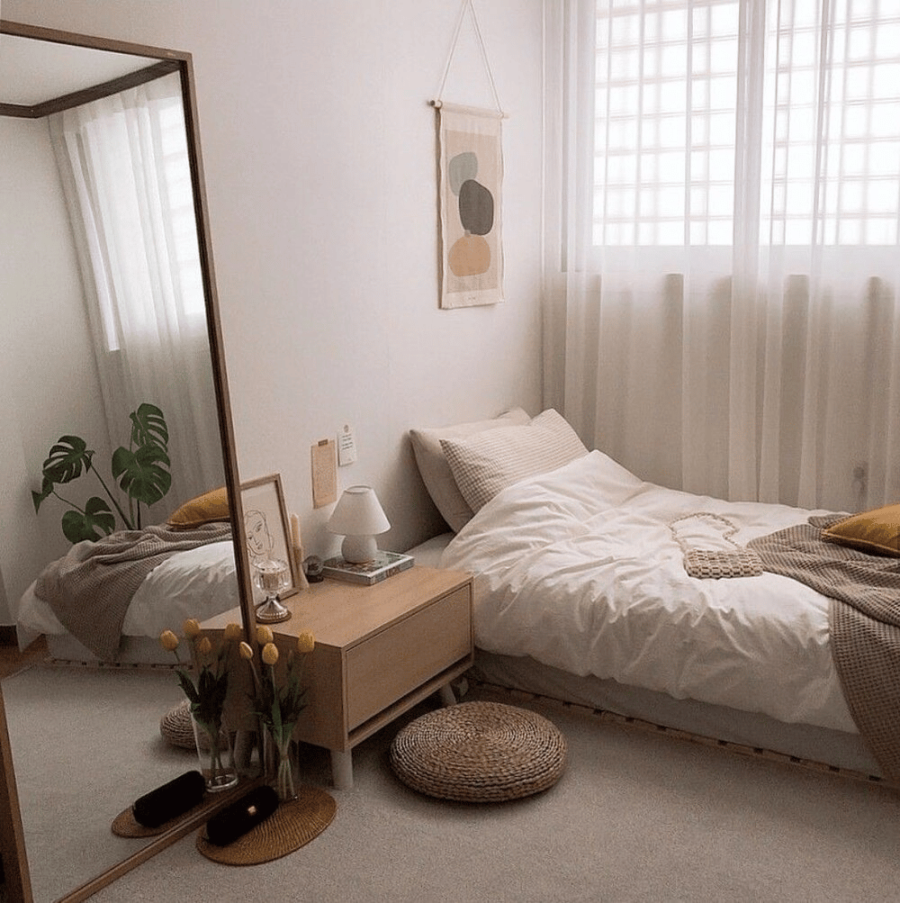 A great way to make your bedroom look bigger is to hang full-length mirrors on the walls.