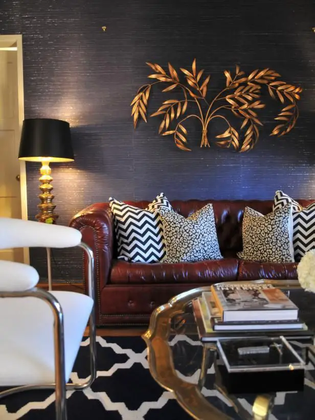 When decorating your room, start by selecting a paint color that complements the burgundy color of your sofas, such as a…