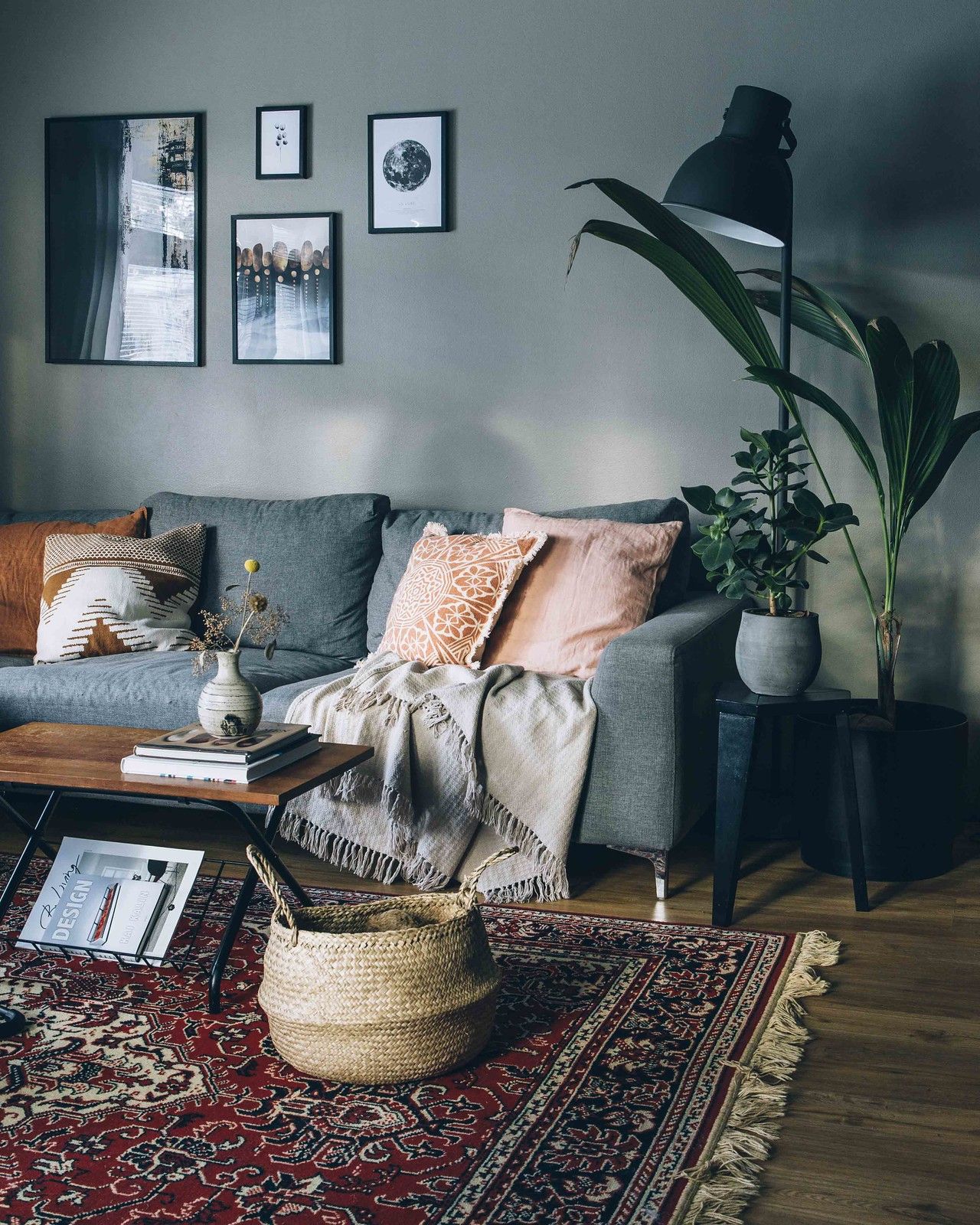 Shop a large bold-colored rug to define the main living space, then add smaller rugs of complementary colors around it for…