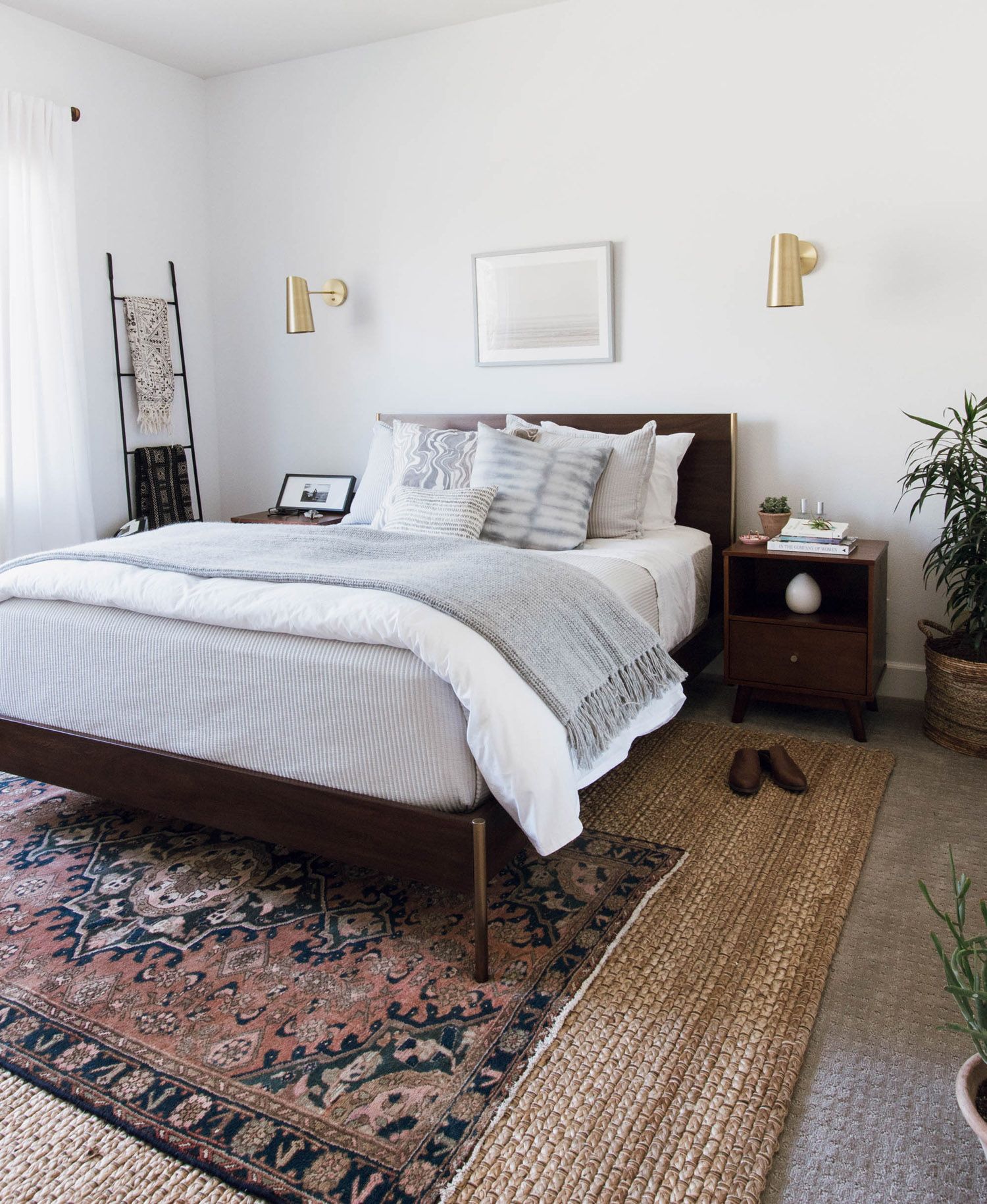 How can I brighten my bedroom with dark furniture?