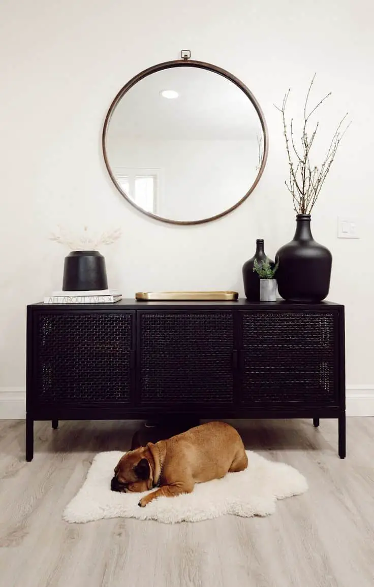 Place books and candles on the top shelf of your TV stand to add character as well as some height variation.