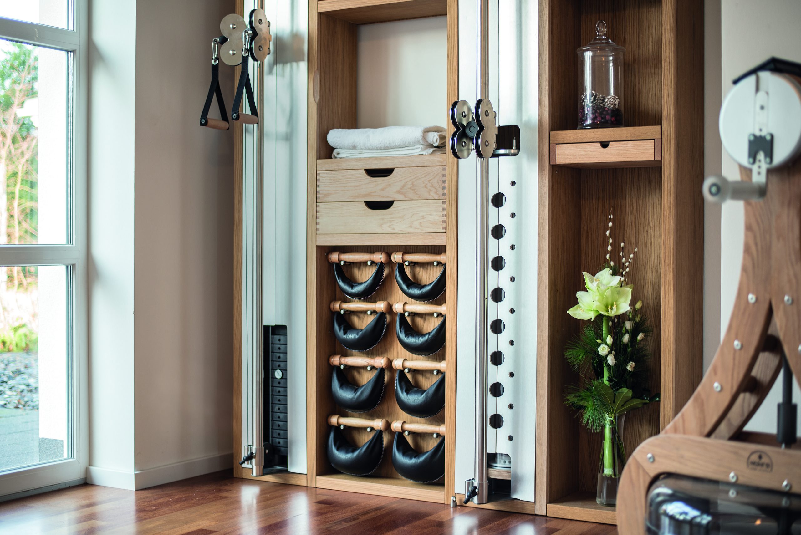 Use the walls to your advantage and take the gym equipment off the floor, such as a pull-up bar.