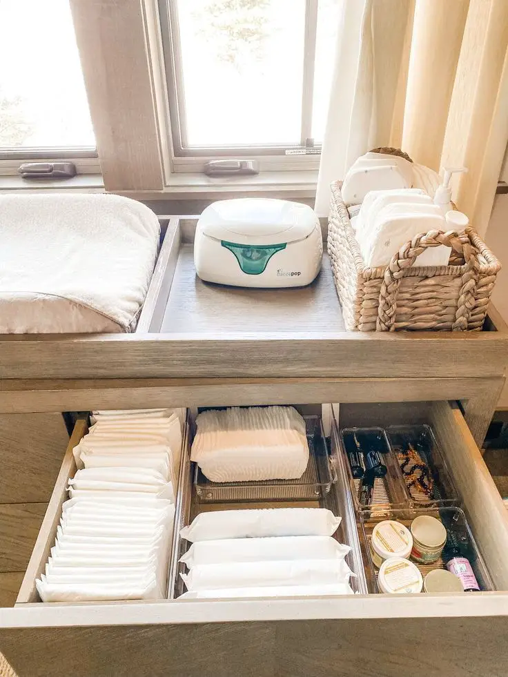 For seasonal items that won’t be used until later on, consider storing them in fabric bins under beds.