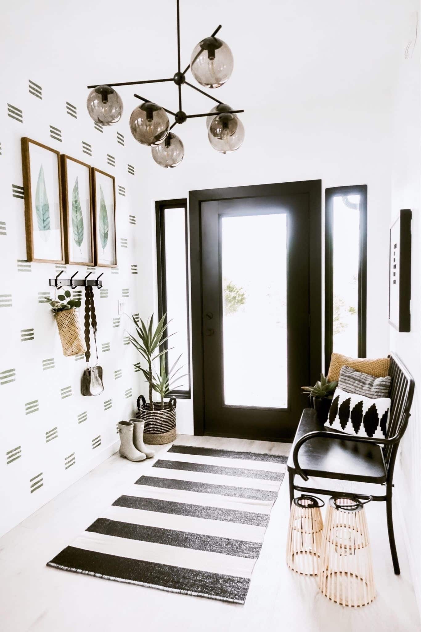 Install light fixtures above the entryway, such as recessed lights or wall sconces which will help make the space feel…