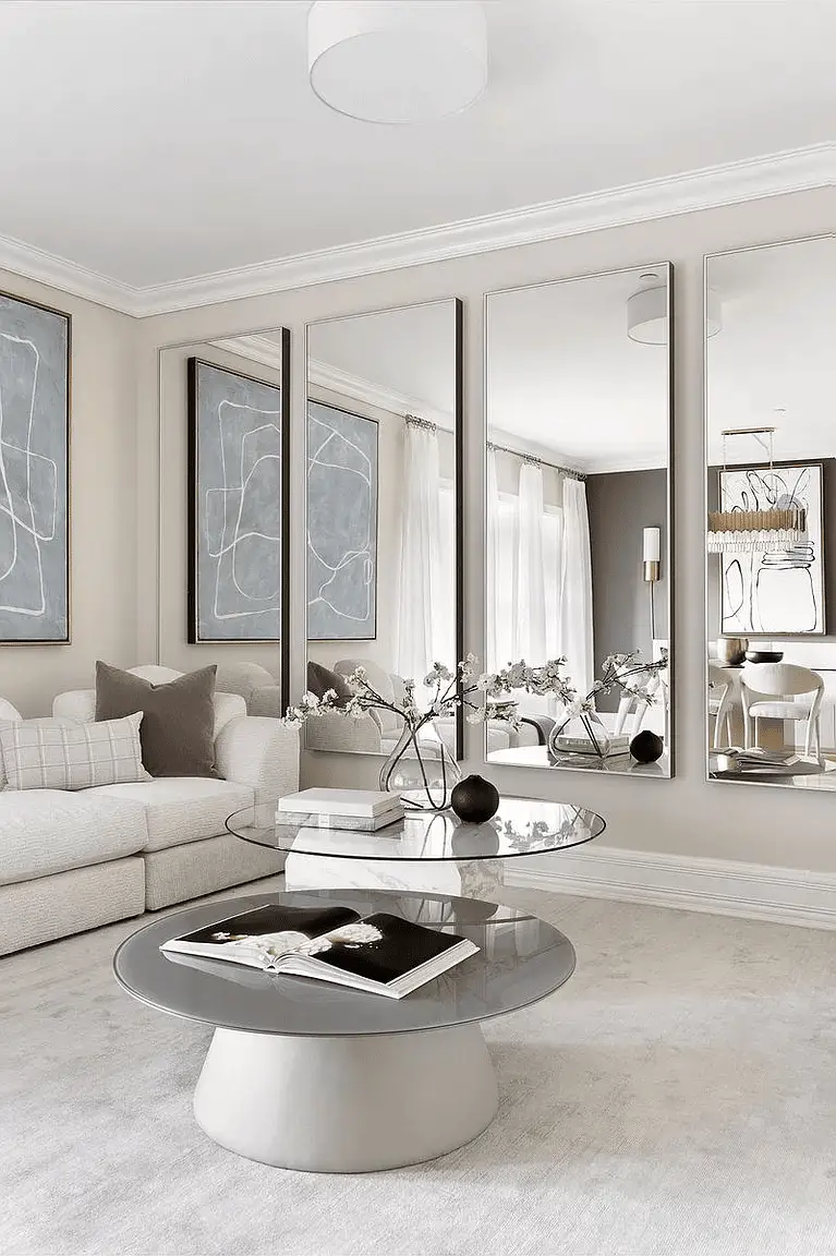 Use Large Wall Mirrors: Placing large mirrors on the walls can create the illusion of more space by reflecting light and…