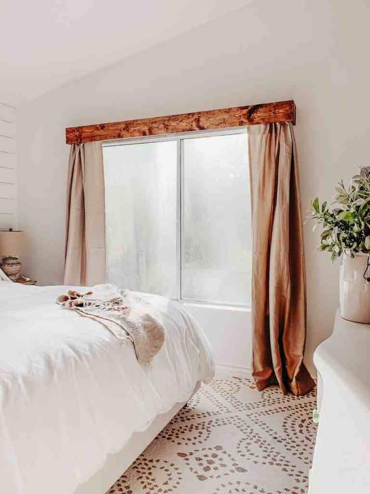 Layer curtains with sheers and valances to add visual interest.