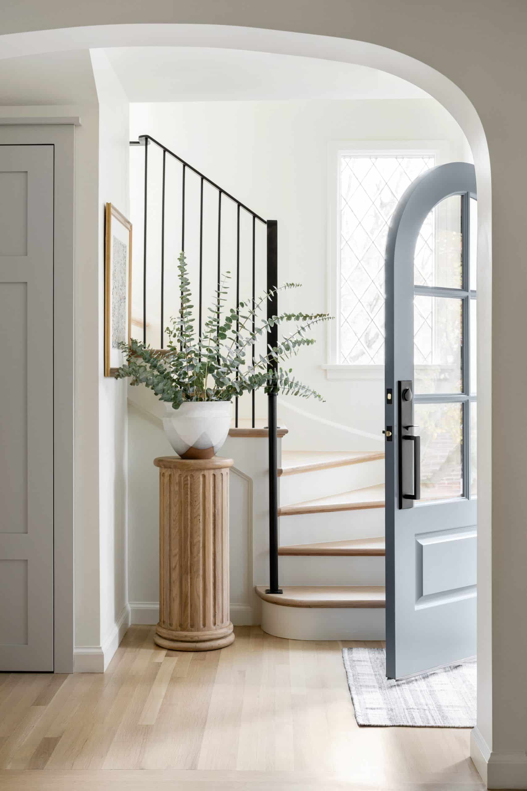 Hang artwork or mirrors on walls opposite the entryway door to help create depth and dimension within the space.