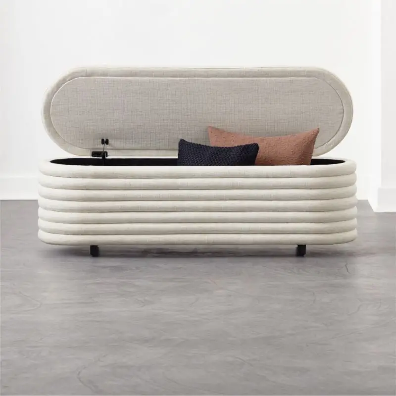Store linens in your bedroom; a bedside bench provides attractive seating and discreet storage.