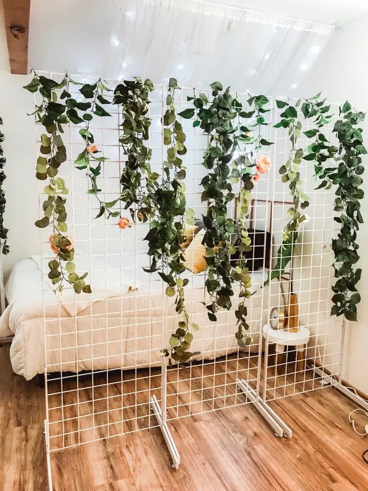 Use houseplants, hanging plants, or fill an etagere with small plants to add to the atmosphere while dividing the room.