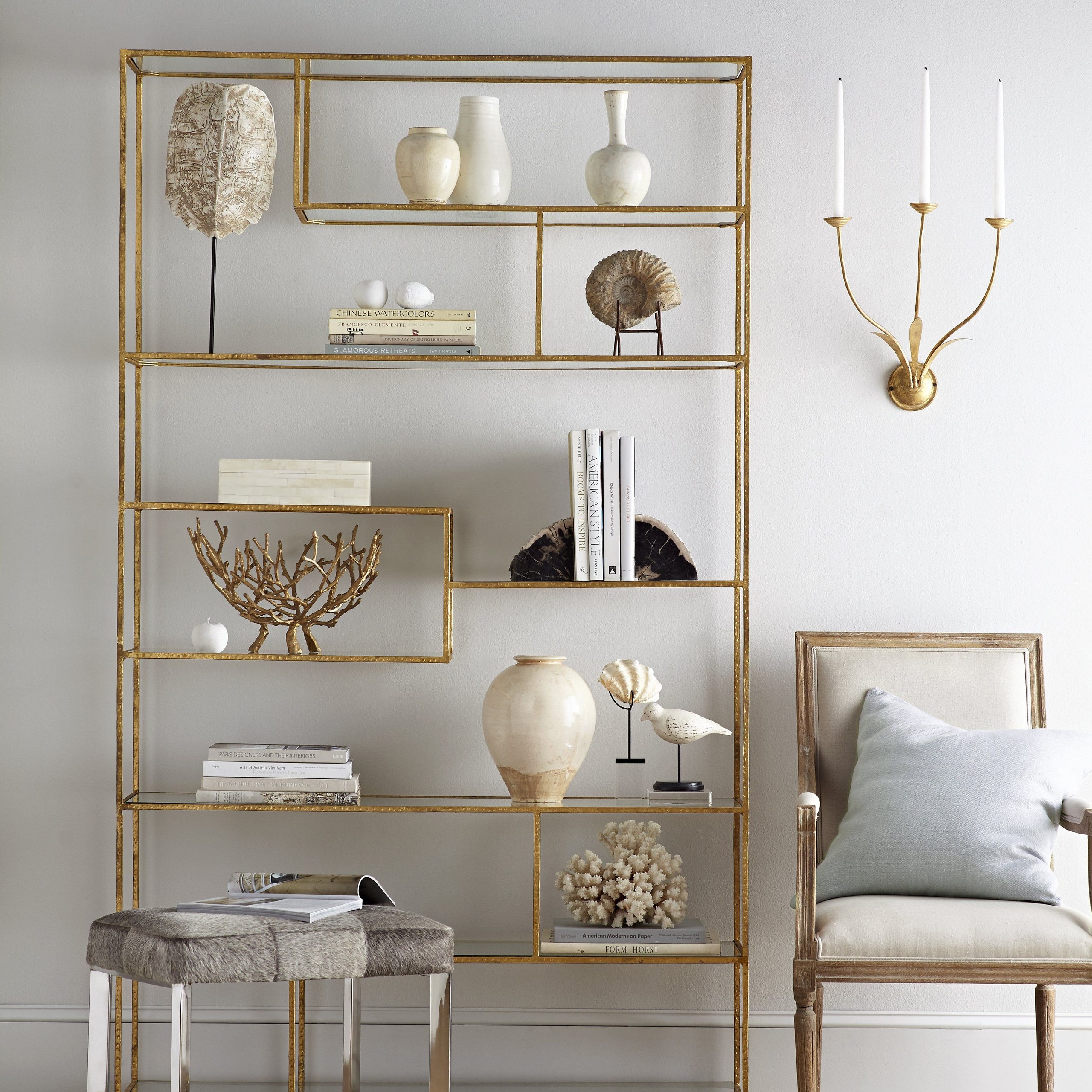 For an organized yet modern display, put books in order of size or color on the shelf and avoid clutter.