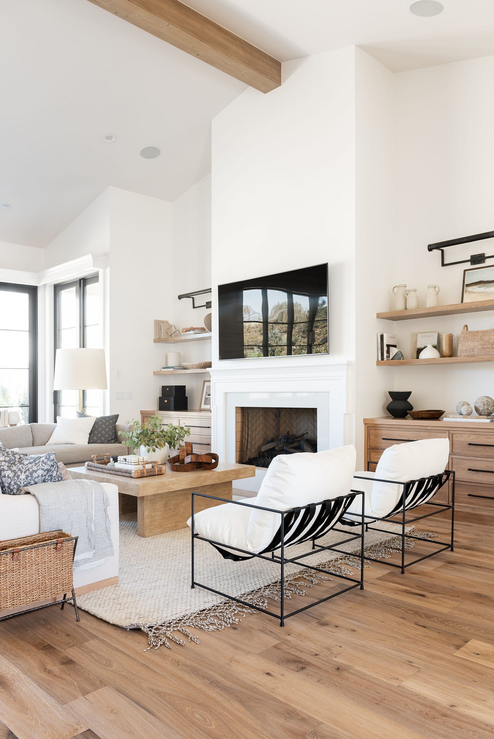 What are some factors to consider when choosing wall colors that will complement wood floors in a room?