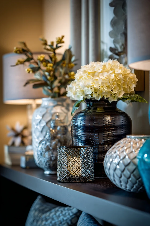 Sunroom corner layered with textiles, cushions and greenery