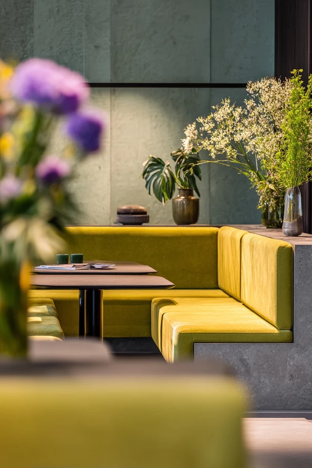 Modern sunken seating area design with textured cushions and a rug