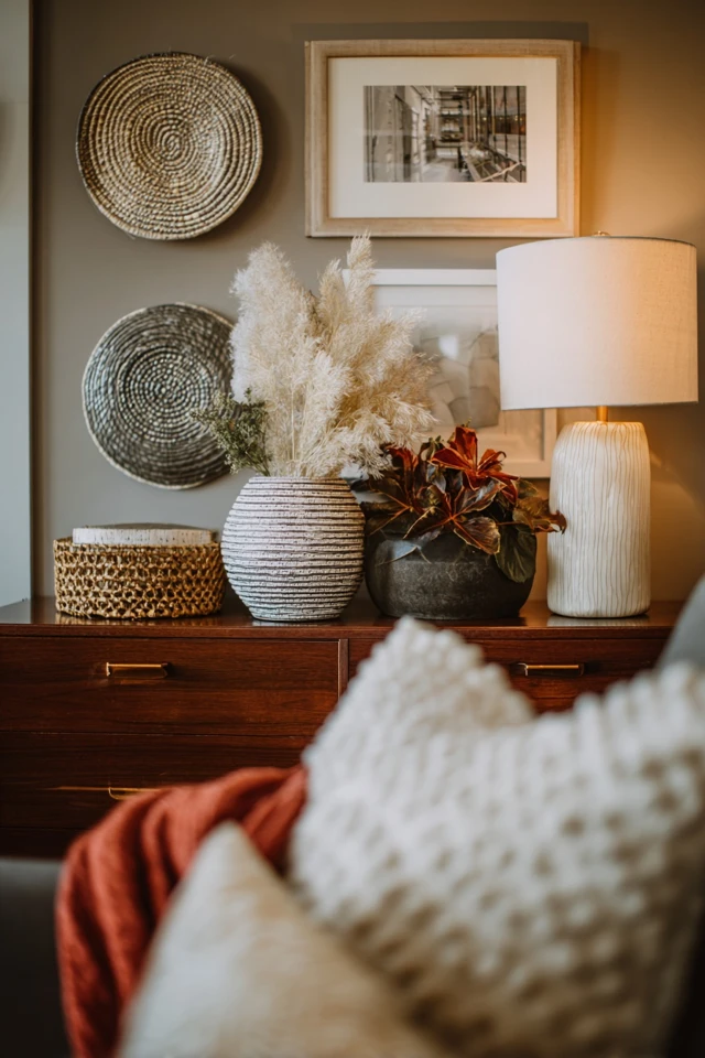 Styled open closet shelves in a small bedroom with neat storage